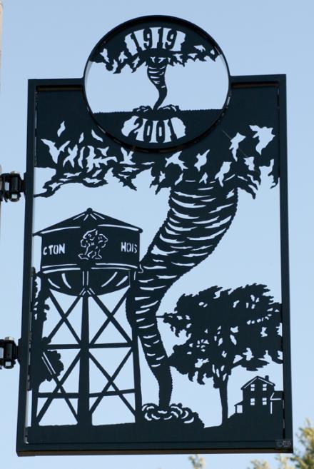 Unique metal street banners greet visitors on Main Street